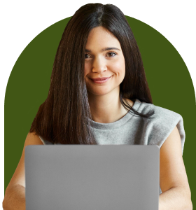 Smiling professional using a laptop to learn how to streamline the hiring process.